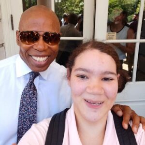 Ashley, an SYEP participant, interned at the NYC Department of Sanitation, and met Mayor Adams at an end of summer event.