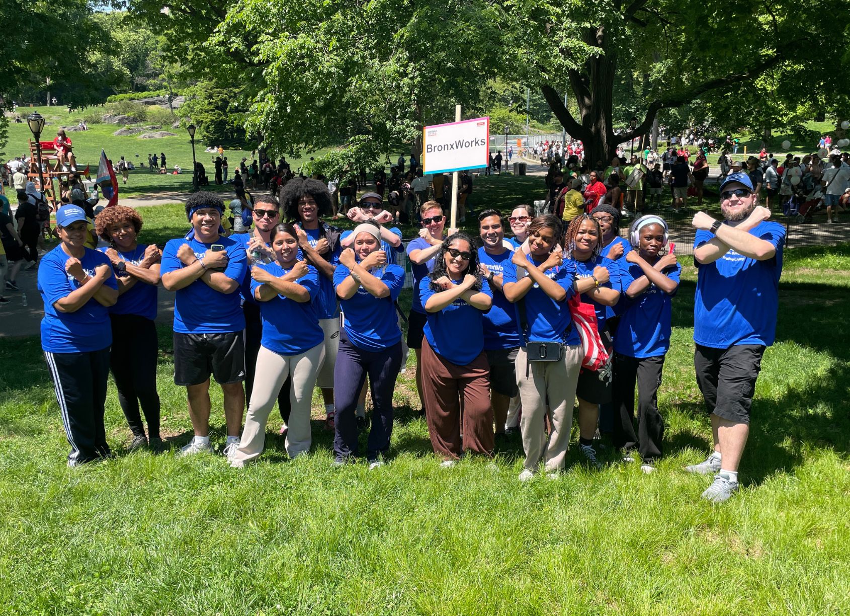 Multiple people stand together wearing BronxWorks shirts